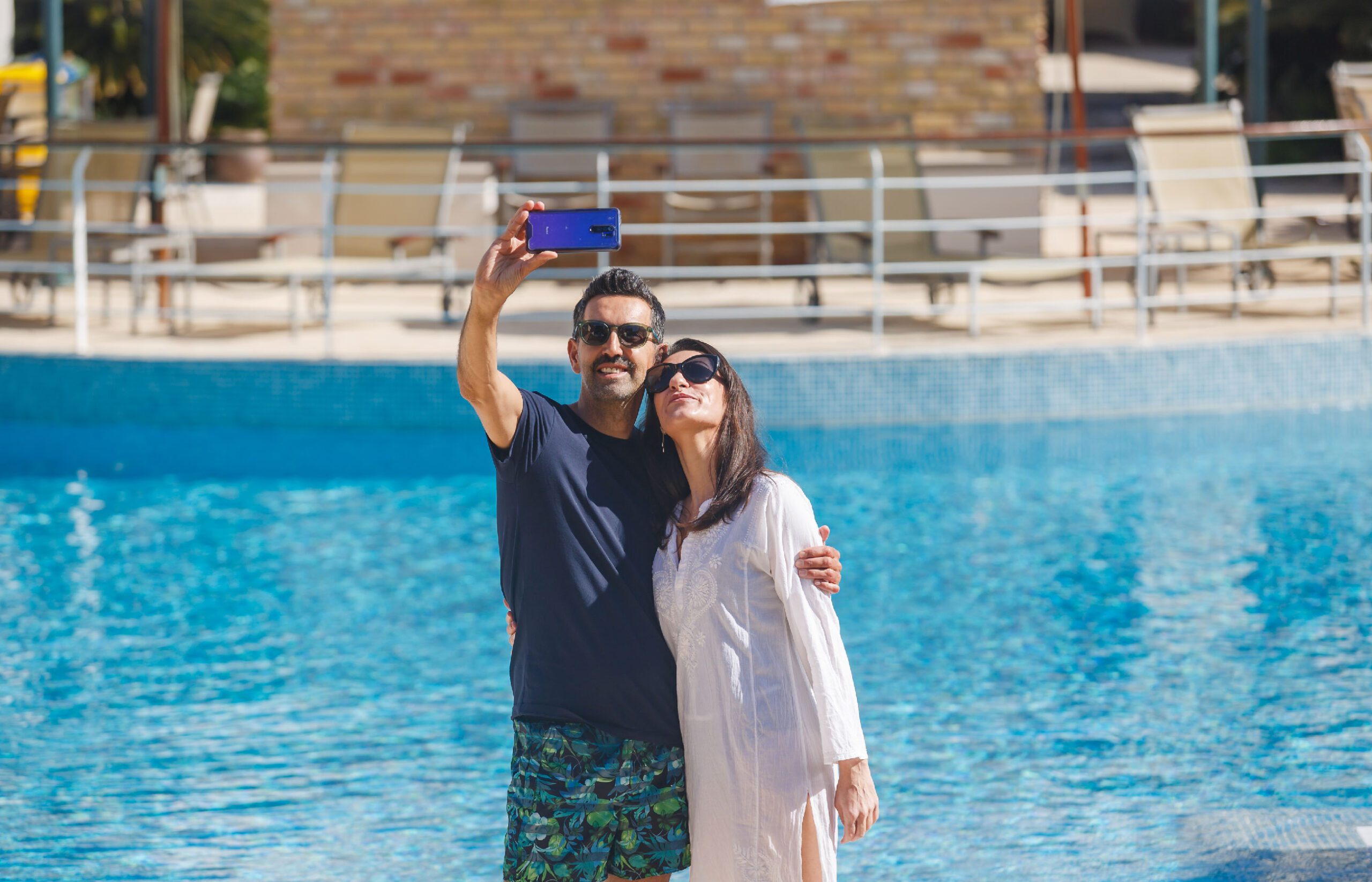 Couple at Pool La Quinta Menorca by PortBlue Boutique Hotel